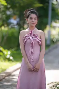 Gentle Charm: A Girl in an Elegant Pink Dress Amidst Nature's Embrace - image 7