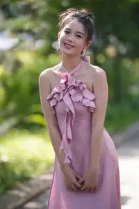 Gentle Charm: A Girl in an Elegant Pink Dress Amidst Nature's Embrace - image 11