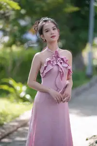 Gentle Charm: A Girl in an Elegant Pink Dress Amidst Nature's Embrace - image 8