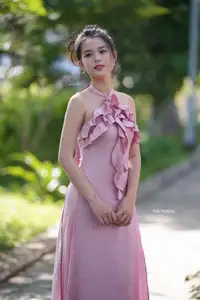 Gentle Charm: A Girl in an Elegant Pink Dress Amidst Nature's Embrace - image 6