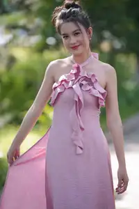 Gentle Charm: A Girl in an Elegant Pink Dress Amidst Nature's Embrace - image 5