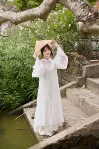 Elegant White Ao Dai with Pink Lotus Flower Embracing Cultural Heritage - image 8