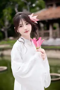 Elegant White Ao Dai with Pink Lotus Flower Embracing Cultural Heritage - image 5