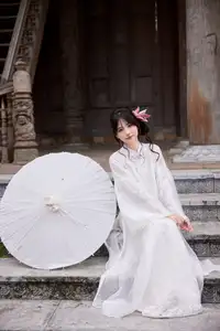 Elegant White Ao Dai with Pink Lotus Flower Embracing Cultural Heritage - image 9