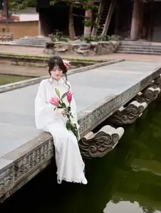 Elegant White Ao Dai with Pink Lotus Flower Embracing Cultural Heritage - image 10