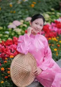 Discover the Graceful Beauty of a Vietnamese Girl in Traditional Pink Ao Dai 1000028168 - image 1