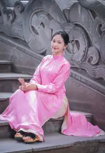 Discover the Graceful Beauty of a Vietnamese Girl in Traditional Pink Ao Dai 1000028168 - image 2