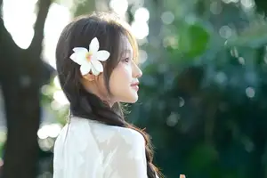 Pure Charm: White-Dressed Girl Winking Playfully with White Flowers 1000024585 - image 5