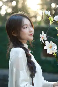 Pure Charm: White-Dressed Girl Winking Playfully with White Flowers 1000024585 - image 3
