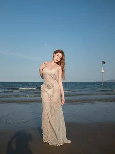 Sunlit Beach Fashion: Vietnamese Influencer Turns Heads in Bold Fishnet Dress - image 1