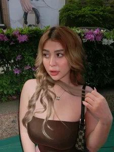 Sunlit Beach Fashion: Vietnamese Influencer Turns Heads in Bold Fishnet Dress - image 3