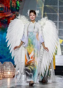 Beauty Queens Showcase Elegant Ao Dai Designs on Nguyen Hue Walking Street - image 14