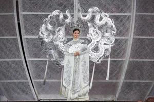 Beauty Queens Showcase Elegant Ao Dai Designs on Nguyen Hue Walking Street - image 4