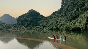 H'Hen Nie and Ngoc Chau Make Dramatic Catwalk Entrance on Rafts - image 11