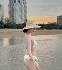 Timeless White Swimwear Trends: Beautiful Beachside Portrait Inspiration and Styling Guide - image 14