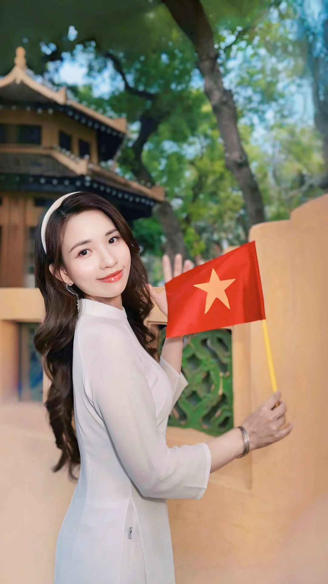 Runner-up Mivi Diem Anh Shines in Vibrant Ao Dai for Vietnam's Reunification Day