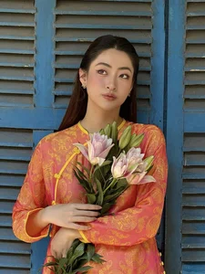 Vietnamese Celebrities Shine in Traditional Ao Dai for Lunar New Year 2024 Celebrations - image 40