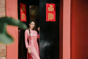 Vietnamese Celebrities Shine in Traditional Ao Dai for Lunar New Year 2024 Celebrations - image 25