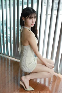 Chic Fashion Gallery: Xiaobao Features a Stunning Halter Neck Bodycon Dress in Latest IESS Collection - image 8