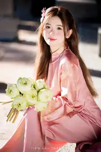 Captivating Serenity: Vietnamese Girl in Pink Ao Dai with Lotus Flowers1730591 - image 4