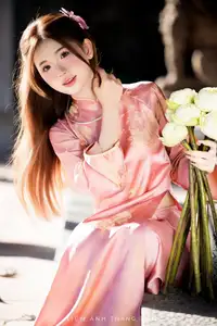 Captivating Serenity: Vietnamese Girl in Pink Ao Dai with Lotus Flowers1730591 - image 18