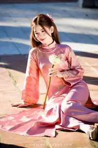 Captivating Serenity: Vietnamese Girl in Pink Ao Dai with Lotus Flowers1730591 - image 1