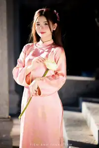 Captivating Serenity: Vietnamese Girl in Pink Ao Dai with Lotus Flowers1730591 - image 0