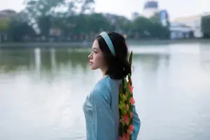 Serene Beauty: Vietnamese Young Woman by the Lake in Traditional Attire - image 6