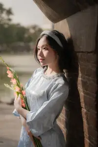 Serene Beauty: Vietnamese Young Woman by the Lake in Traditional Attire - image 4