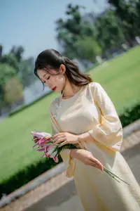 Serene Vietnamese Beauty in Ao Dai with Lilies: A Moment of Grace and Tranquility - image 7