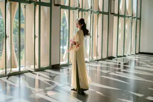 Serene Vietnamese Beauty in Ao Dai with Lilies: A Moment of Grace and Tranquility - image 10