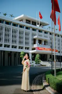 Serene Vietnamese Beauty in Ao Dai with Lilies: A Moment of Grace and Tranquility - image 5