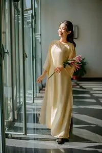 Serene Vietnamese Beauty in Ao Dai with Lilies: A Moment of Grace and Tranquility - image 3