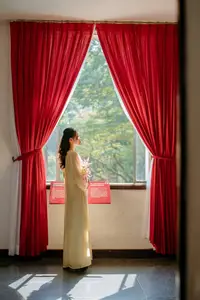 Serene Vietnamese Beauty in Ao Dai with Lilies: A Moment of Grace and Tranquility - image 4