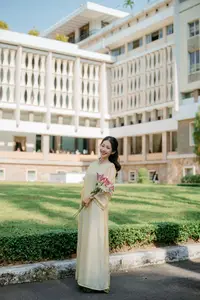 Serene Vietnamese Beauty in Ao Dai with Lilies: A Moment of Grace and Tranquility - image 6