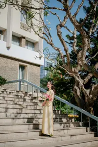 Serene Vietnamese Beauty in Ao Dai with Lilies: A Moment of Grace and Tranquility - image 8