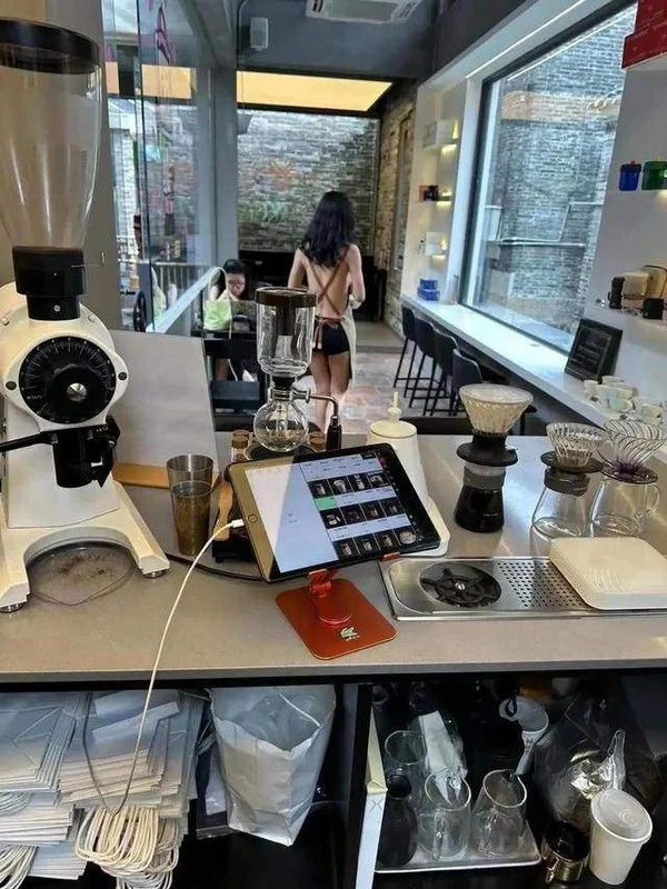 Controversial Cafe Sparks Intense Debate Over Revealing Outfits of Female Staff