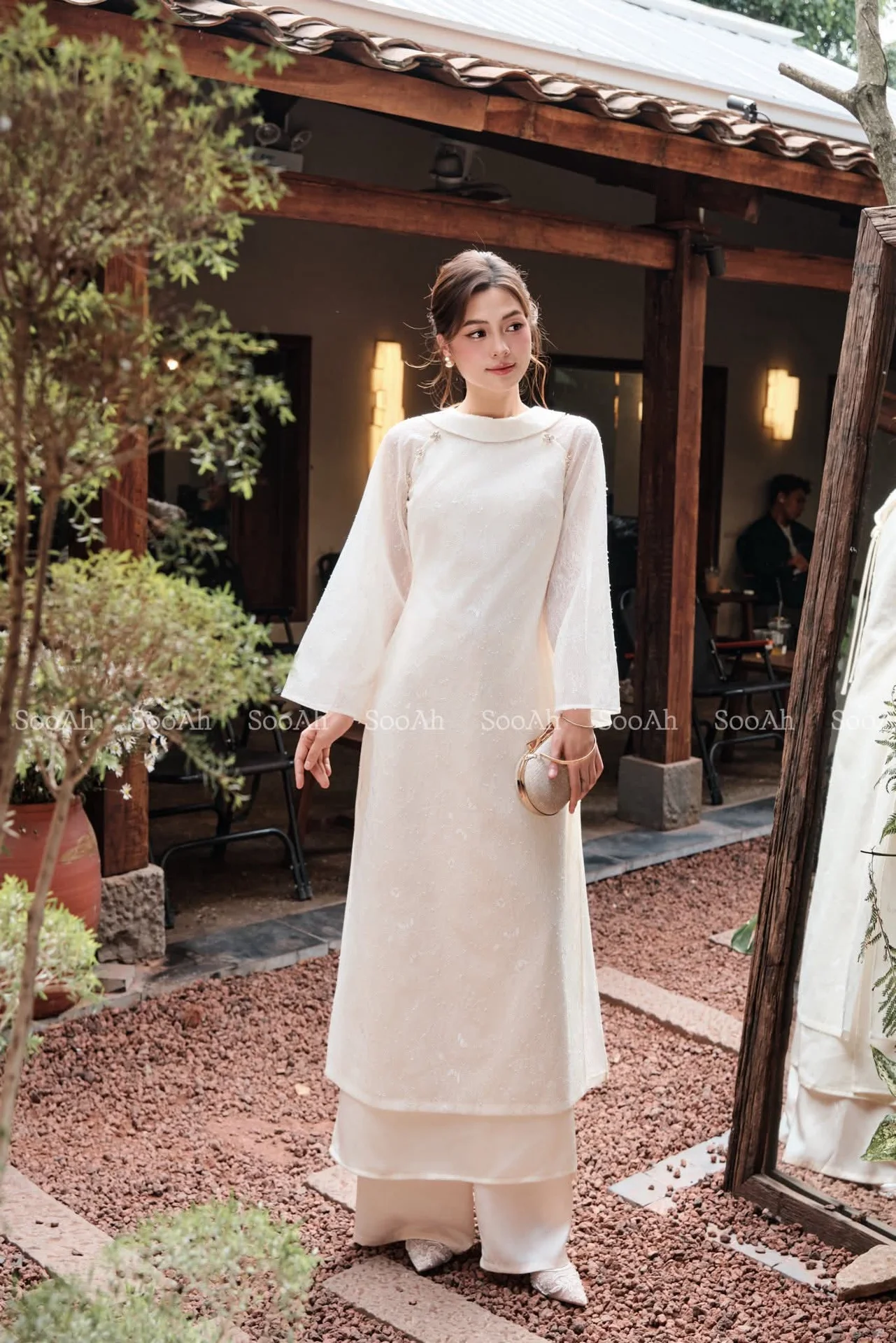 Elegant Vietnamese Muse: Graceful Modern Ao Dai in a Serene Setting