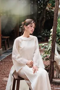 Elegant Vietnamese Muse: Graceful Modern Ao Dai in a Serene Setting - image 1