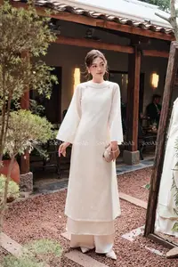 Elegant Vietnamese Muse: Graceful Modern Ao Dai in a Serene Setting - image 0