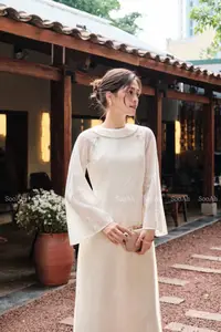 Elegant Vietnamese Muse: Graceful Modern Ao Dai in a Serene Setting - image 4