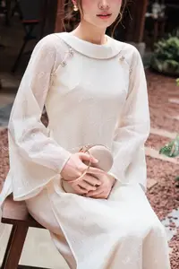 Elegant Vietnamese Muse: Graceful Modern Ao Dai in a Serene Setting - image 5