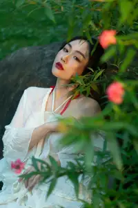 Elegant Woman in White Dress Amidst Lush Green Nature - image 11