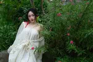Elegant Woman in White Dress Amidst Lush Green Nature - image 17