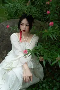 Elegant Woman in White Dress Amidst Lush Green Nature - image 5