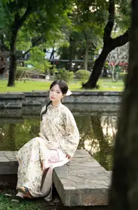 East Asian Traditional Beauty: Gentle Young Woman in Ao Dai with Elegant Wooden Fan - image 3
