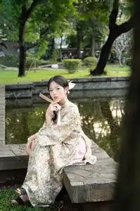 East Asian Traditional Beauty: Gentle Young Woman in Ao Dai with Elegant Wooden Fan - image 21