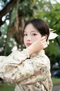 East Asian Traditional Beauty: Gentle Young Woman in Ao Dai with Elegant Wooden Fan - image 0