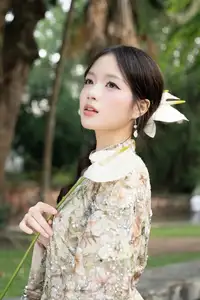 East Asian Traditional Beauty: Gentle Young Woman in Ao Dai with Elegant Wooden Fan - image 6