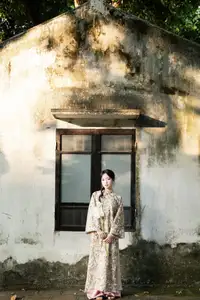 East Asian Traditional Beauty: Gentle Young Woman in Ao Dai with Elegant Wooden Fan - image 2